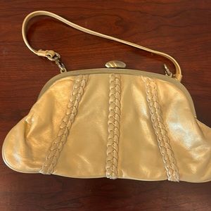 Inge gold leather clutch with braided detail